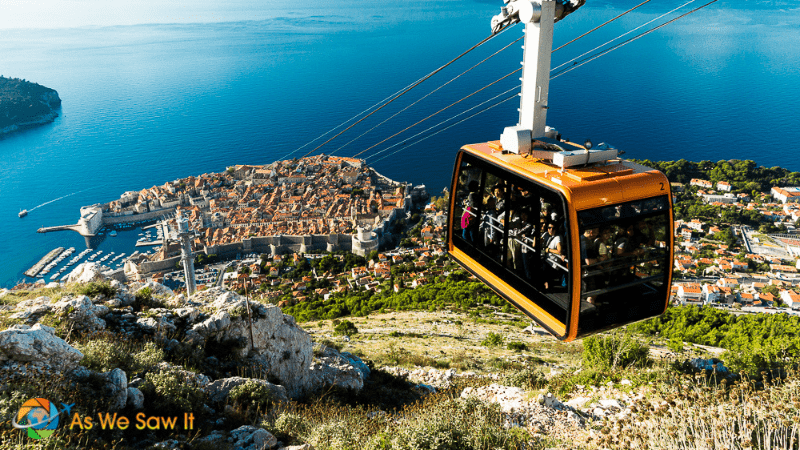 Cable car approaching Mt Srd with the walled city of Dubrovnik Croatia sticking into the Adriatic in background