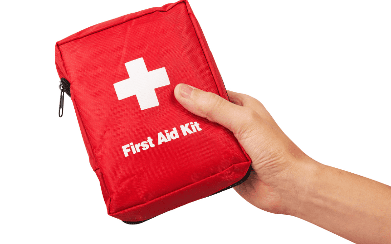 hand holding a first aid kit
