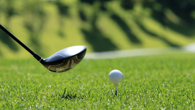 golf club with ball on tee