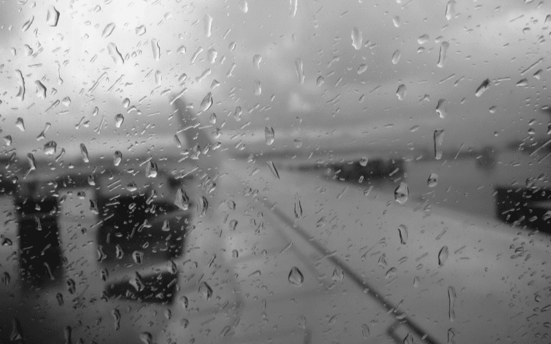 rain and bad weather outside an airplane window