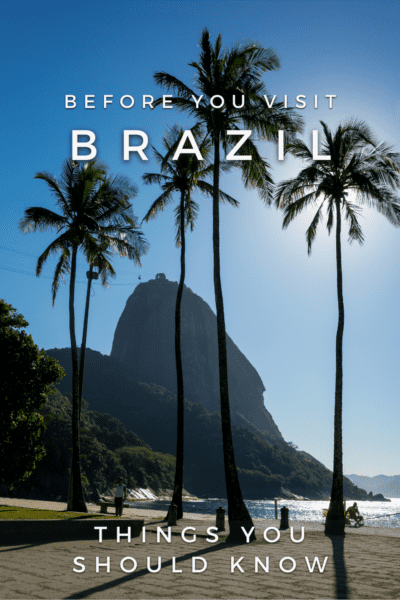 Sugarloaf Mountain behind some palm trees. Text overlay says "before you visit brazil things you should know"