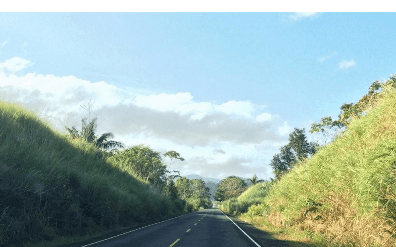 highway bordered by steep hills