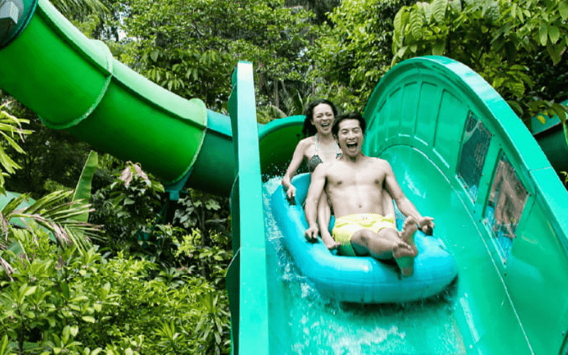 couple riding down a water flume