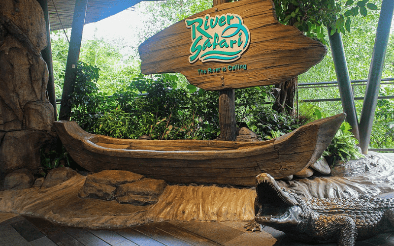 Singapore River Safari sign with alligator sculpture on the ground