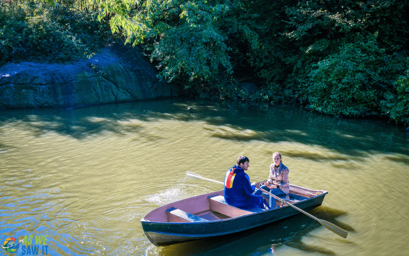 two people in a boat in Central Park NYC