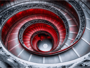 Spiral staircase at the Vatican museums, illuminated in red after dark