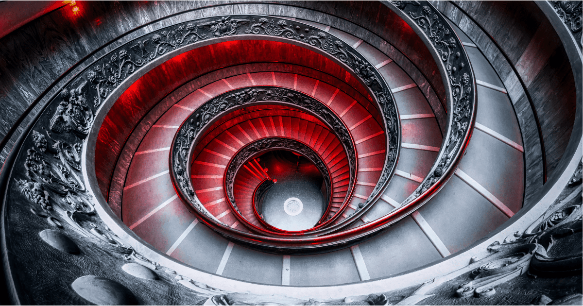 Spiral staircase at the Vatican museums, illuminated in red after dark