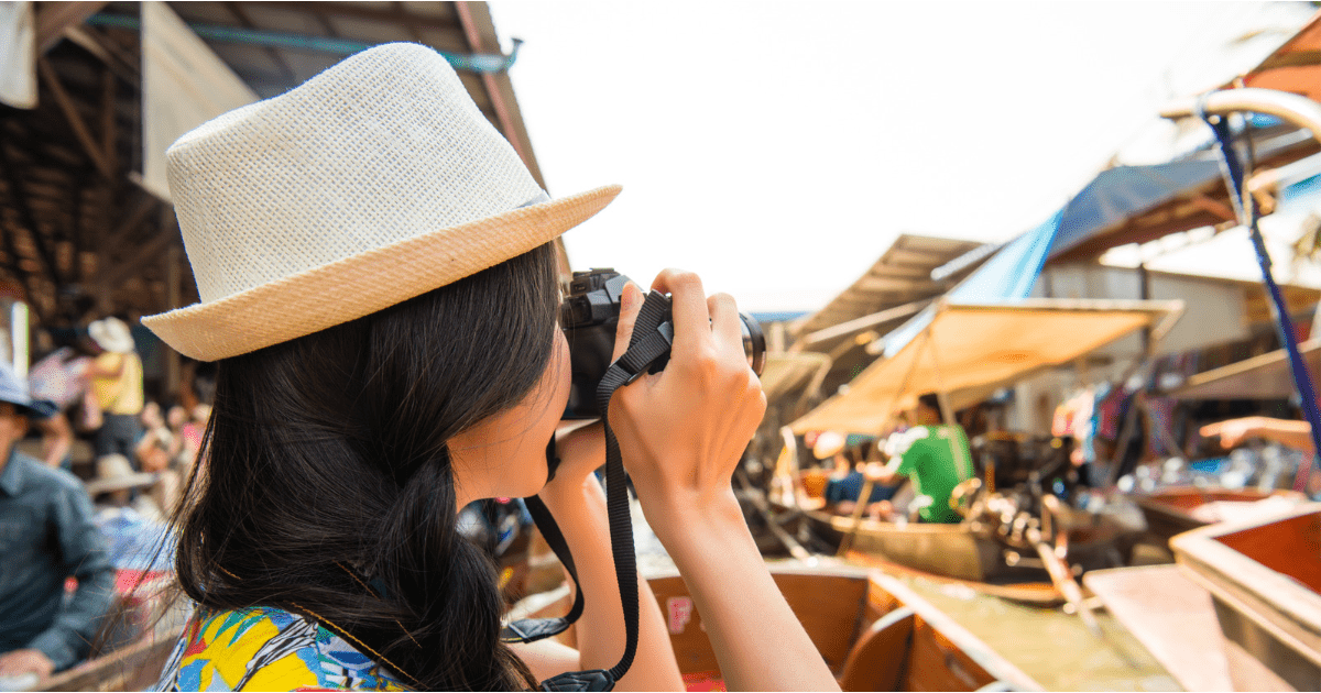 woman taking videos while travleing