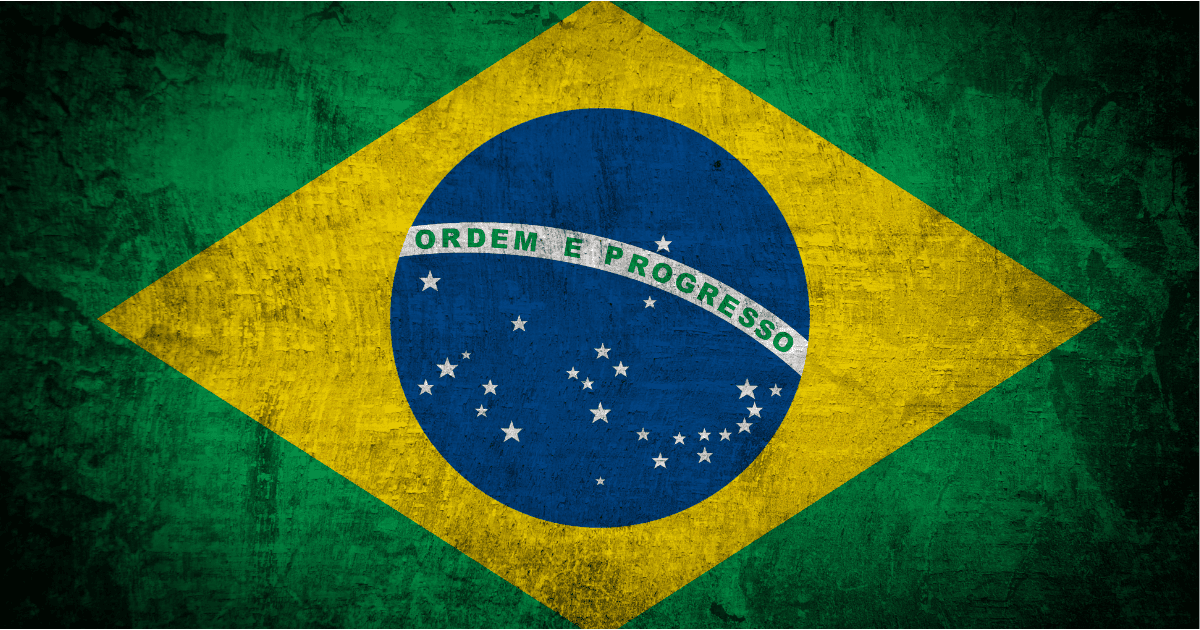 The national flag of Brazil, a blue disc depicting a starry sky (which includes the Southern Cross) spanned by a curved band inscribed with the national motto "Ordem e Progresso" ("Order and Progress"), within a yellow rhombus, on a green field.