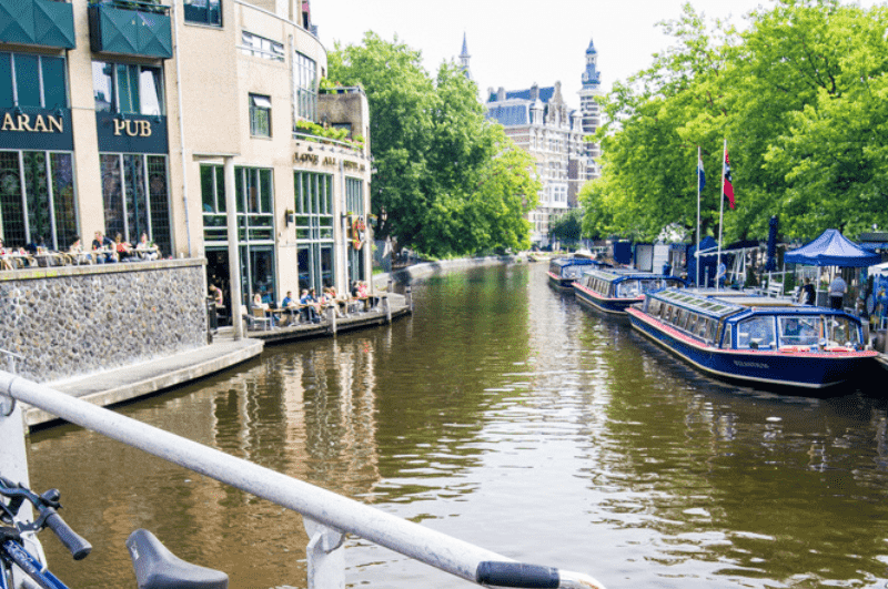 Canal cruise boats in Amsterdam across from the Hard Rock Cafe