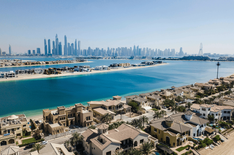 A waterway separates homes and downtown Dubai