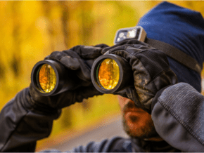 man using binoculars