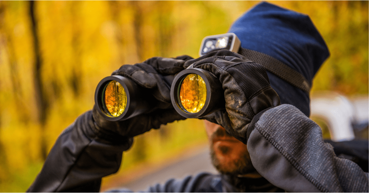 man using binoculars