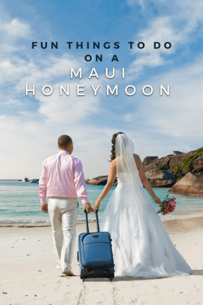 Bride and groom on a beach with a carry-on suitcase. Text overlay says "Fun things to do on a Maui honeymoon"