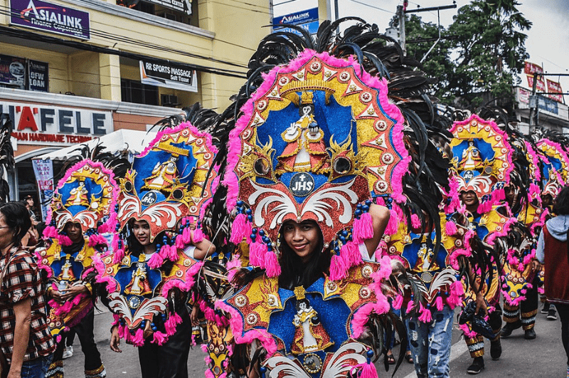 women in colorful costumes at the Ati-Atihan festival