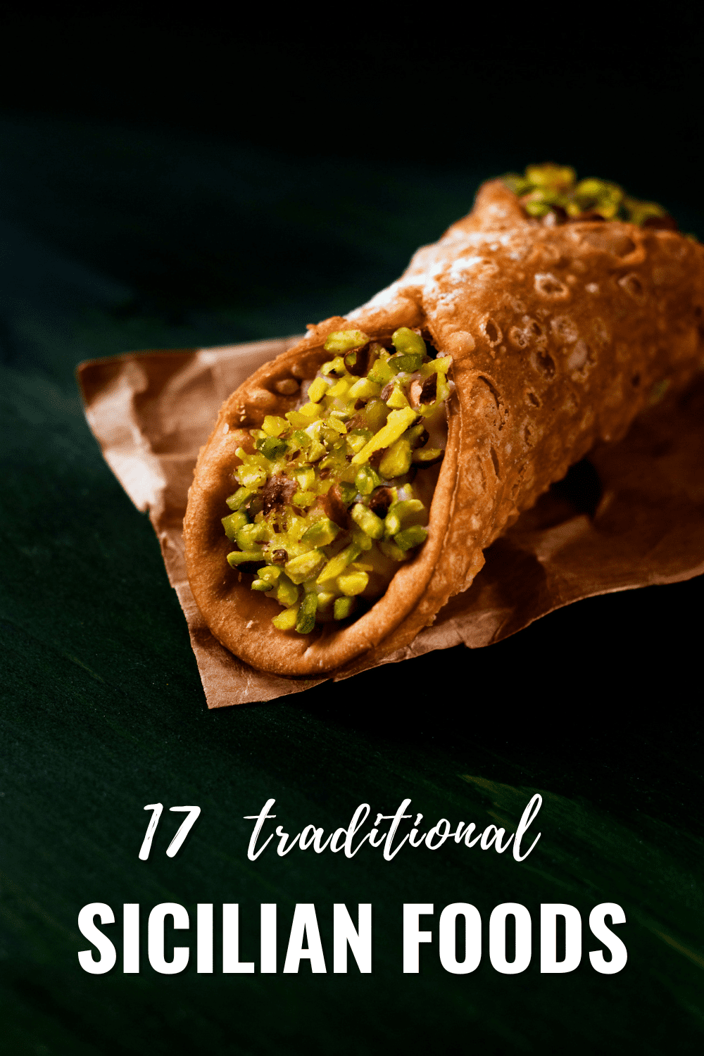 Cannoli sprinkled with crushed pistachios. Text overlay says "17 traditional Sicilian foods"