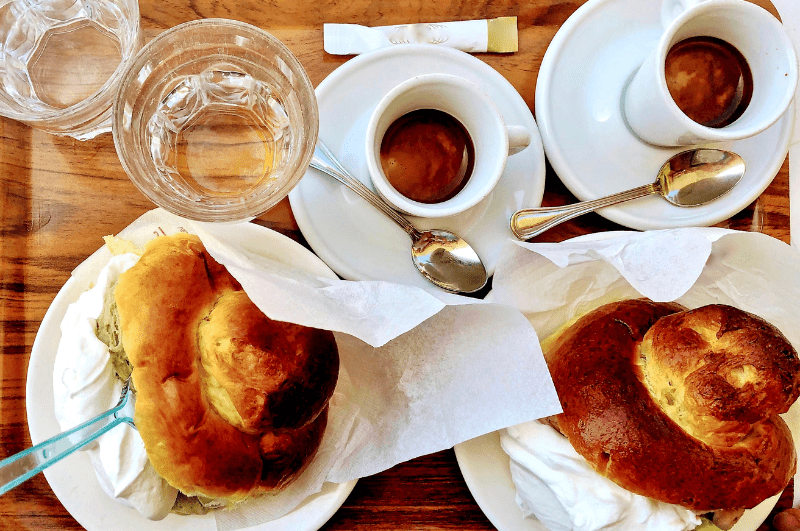 cups of espresso and plates of brioche con gelato