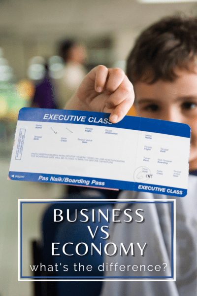 Man holding up a plane ticket for executive class. Text overlay says "business vs economy What's the difference?"