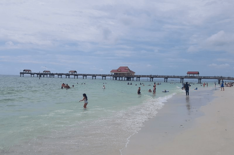 White sand and people in the water at Clearwater Beach Florida