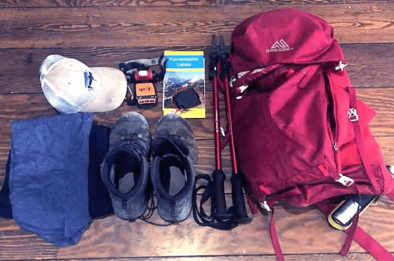 Everest base camp trekking gear - shoes, pole, backpack, guide, hat, etc