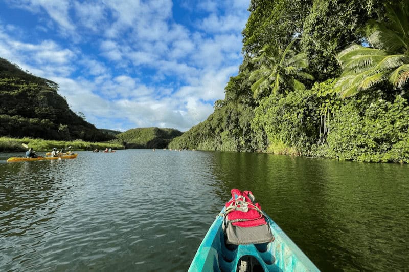 Prow of a kayak in the water in Kauai Hawaii