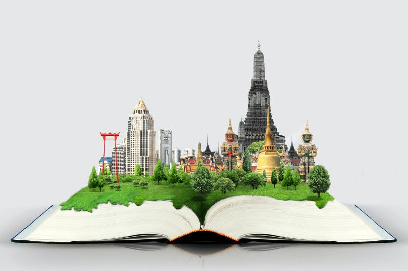 Book with various world landmarks springing from its pages