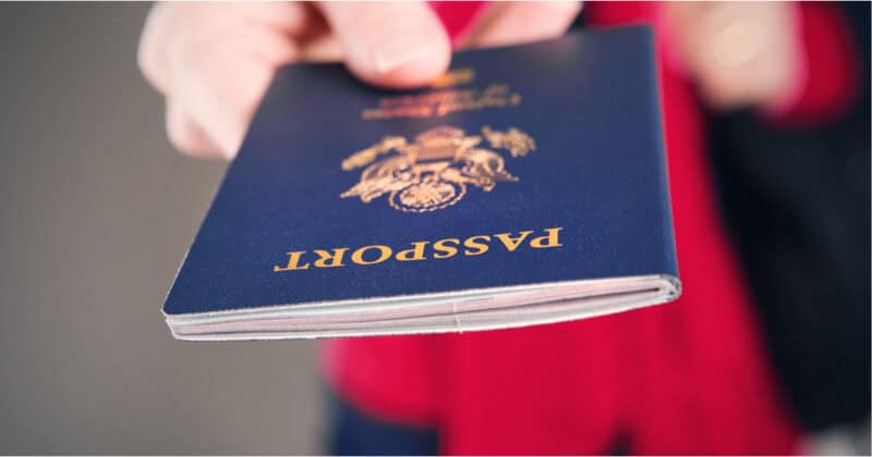 hand presenting a US passport