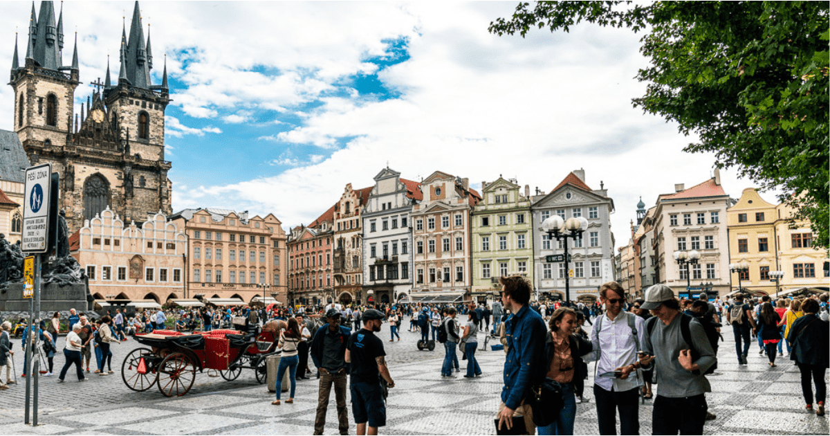 Tourists walking around Wenceslas Square, an essential stop on a Prague 3 day itinerary