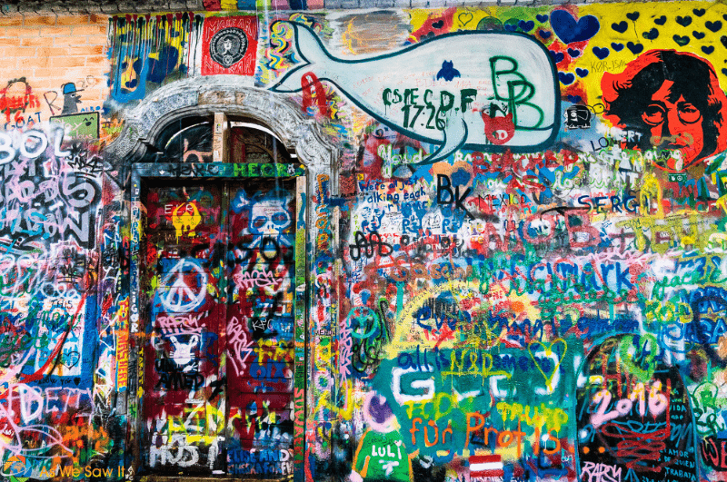 Lennon Wall and door painted by artists in Prague