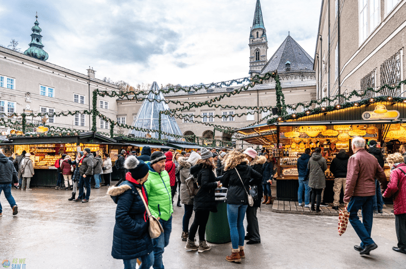 People walking around one of the Christmas markets in Salzburg Austria