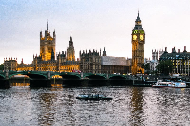 Elizabeth Tower and Westminster Abbey reflected in the Thames River
