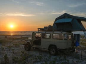 4-wheel-drive car set up for camping