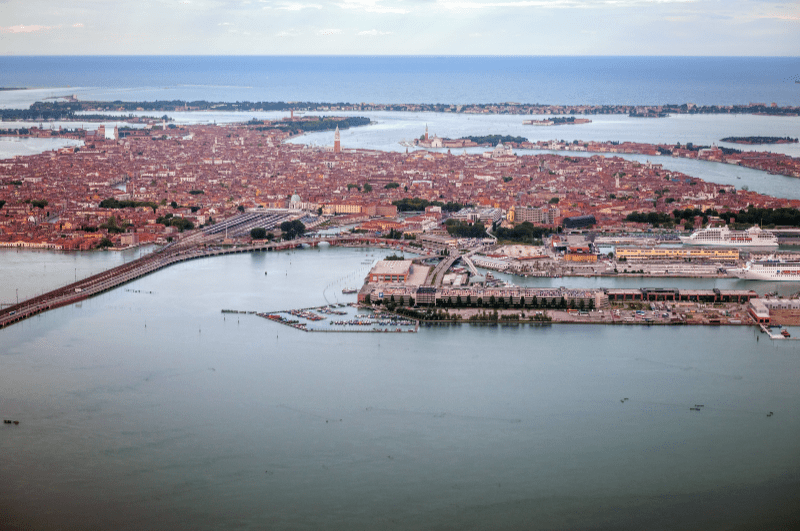 aerial view of Venice, Italy. Road and train tracks leading to Piazzale Roma in lower left.