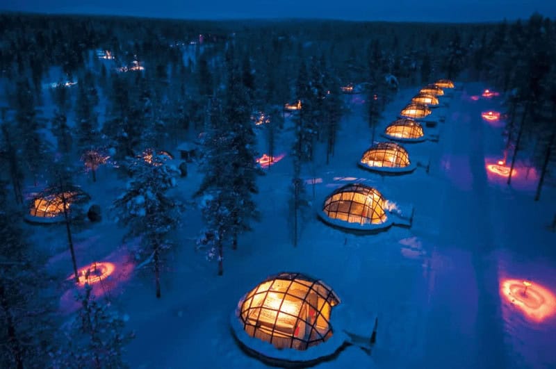 Kakslauttanen Arctic Resort. This resort features unique glass igloos that allow guests to experience the Northern Lights and the starry sky from the comfort of their beds. It's located in Finnish Lapland, which is renowned for its opportunities to view the aurora borealis.