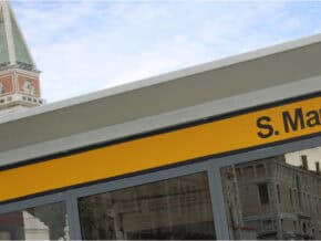 Closeup of the sign on S. Marco vaporetto stop, with Venice campanile in the background