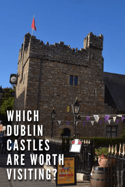 Dalkey Castle, with a sign on the sidewalk in foreground. Text overlay says "which Dublin castles are worth visiting?"