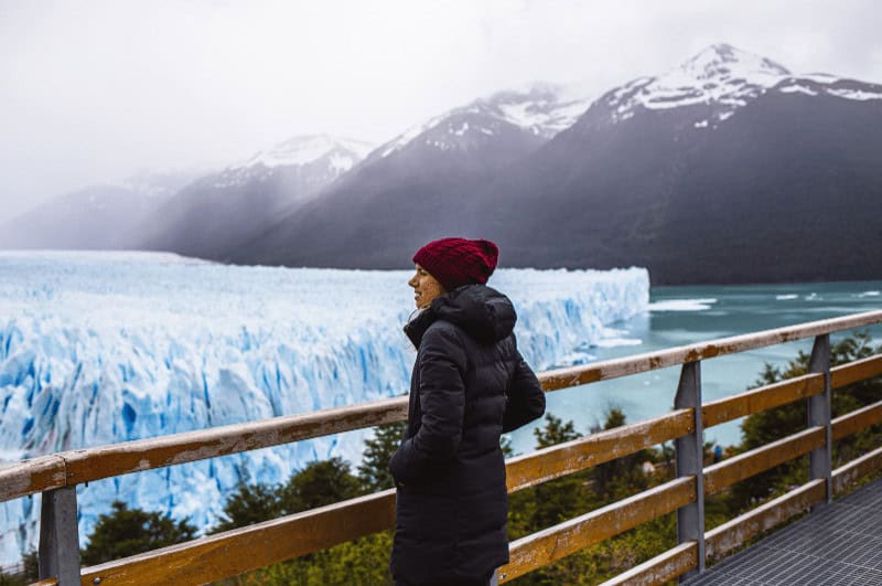 Woman looking at an iceberg