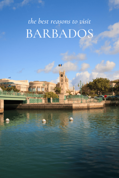 Bridgetown Barbados reflected in the water. Text overlay says "the best reasons to visit Barbados."