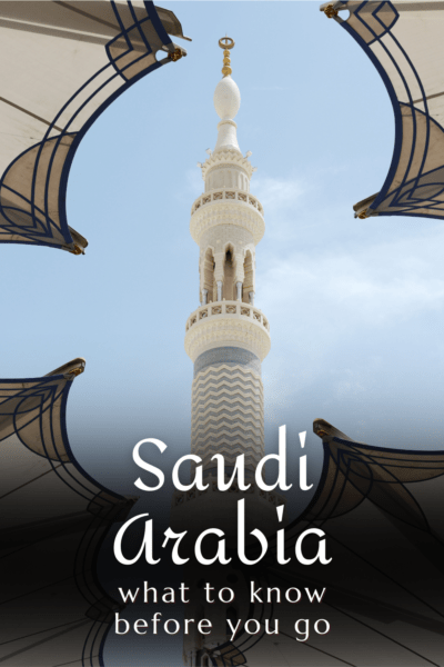 A minaret framed by a window. Text overlay says "Saudi Arabia: What to know before you go"