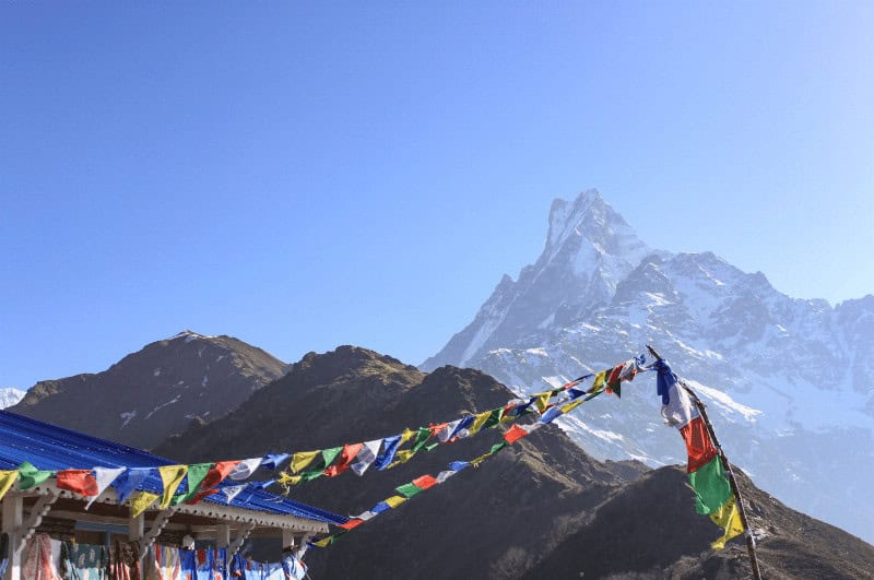 Mount Machhapuchhre and prayer flags seen from Mardi Himal High Camp, Nepal, Asia