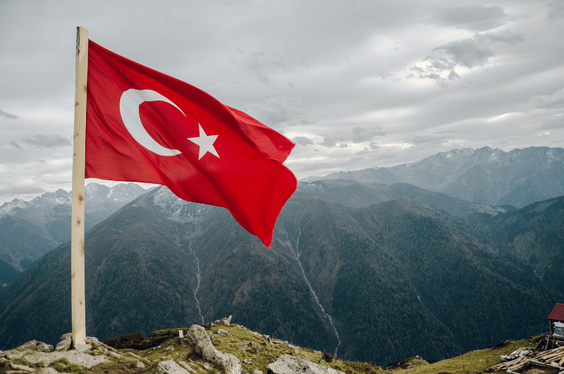 Turkish flag with the Bosphorus in the background.