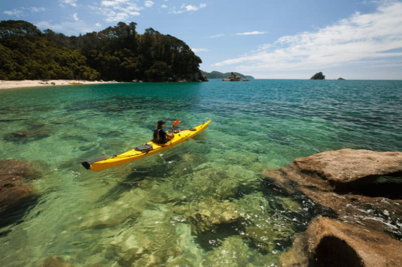 Person kayaking in Abel Tasman National Park