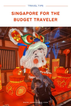 Woman and child posing in front of a Chinese New Year figure. Text overlay says Singapore for the budget traveler.