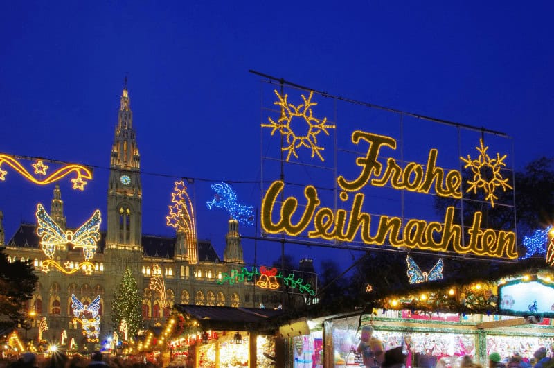 Vienna Christmas market. Sign says Frohe Weinachten