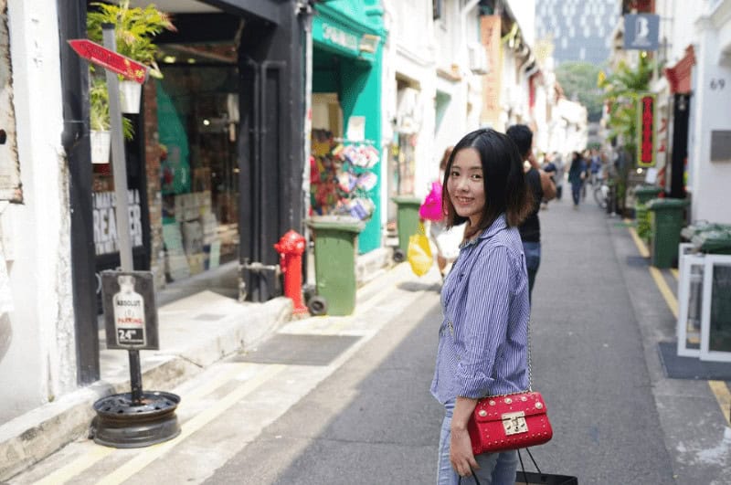 A woman walking on Haji Lane in Singapore
