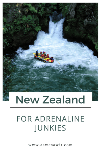 People whitewater rafting in New Zealand. The text overlay says "New Zealand for adrenaline junkies."