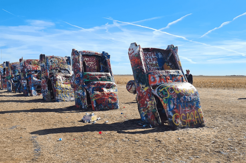 Spray-painted cars buried in the ground at Cadillac Ranch