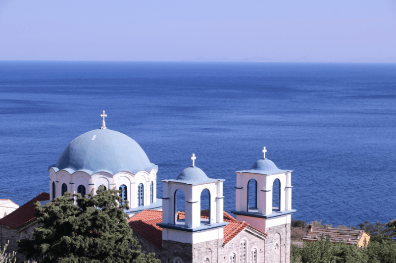 Blue domes of a church in Xilosirtis, Ikaria Greece