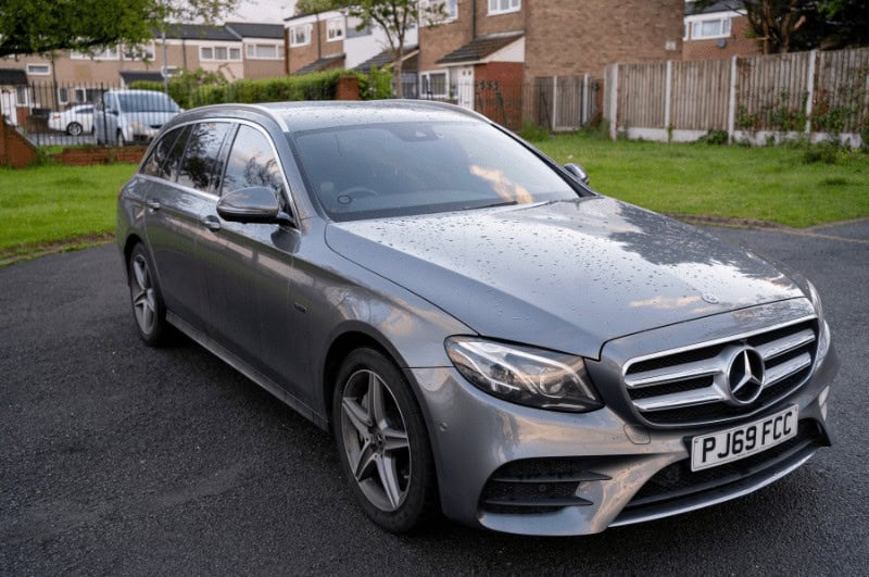 Mercedes-Benz E-Class parked at a house in Europe