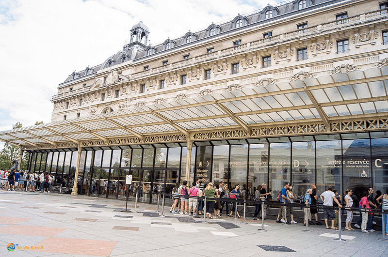 Museumgoers waiting in line at Orsay Museum in Paris
